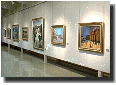 松島正幸記念館に展示作品が7つかけられた壁の写真